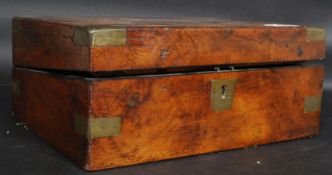 A 19th century Victorian walnut and brass bound writing slope box having an appointed interior (