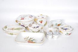 A Royal Worcester Evesham pattern dinner service comprising tureens, coddlers, serving dishes,