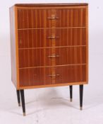 A retro 1970's Danish style teak wood chest of drawers having central bank with original handles