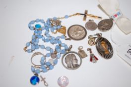 Lourdes beaded rosary together with varioussilver religious pendants and ring.