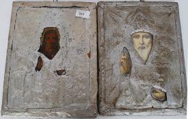 A near pair of distressed Russian Icons having later gilt paint
