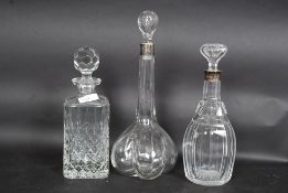 Two hallmarked silver collared decanters along with a lead crystal decanter