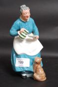 A Royal Doulton figurine entitled ' The Favourite ' being stamped to the base