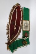 A vintage miners association and prosperity lodge presidents sash along with a Christus Noster