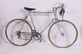 A retro 1970's road / racer push bike having drop handle bars 10 speed gears,