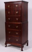 A mid 20th century mahogany Queen Anne style chest on chest of drawers.