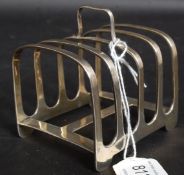 An Edwardian silver hallmarked toast rack by Stokes & Ireland Ltd -William Henry Stokes & Arthur