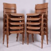 A stack of 10 retro 1950's ply panel wood Industrial school chairs raised on bentwood legs with