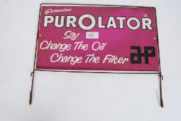 A vintage automotive enamel style advertising sign for PurOlator oil.