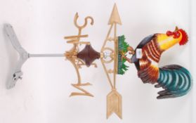A contemporary heavy cast iron weather vane, with seated cockerel to top and moving pointer to base.
