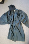 A vintage early to mid 20th century scholars mortar board tog along with his gown by J Wippell & Co