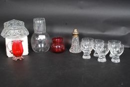 A collection of  cut glass to include decanter and chased shot glasses x 6 along with  cranberry