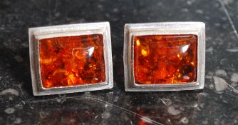 A pair of white metal ( 925 silver ) and amber ladies earrings