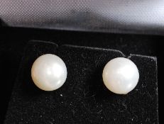 A pair of 925 white metal silver and pearl earrings