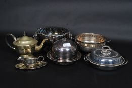 A silver plate muffin dish won in a bridge game at Dunster castle along with other pieces of plate