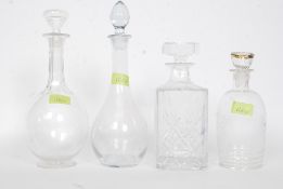 A collection of 4 decanters to include 2 fine Edwardian chase decorated examples,