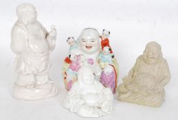 A collection of 4x vintage ceramic Buddha figurines.