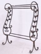 A wrought iron effect Victorian style towel rail