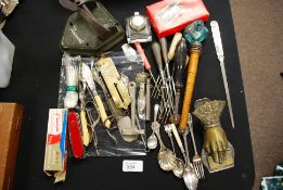A dealers lot to include silver flatware, silver plated flatware, brass hand paper holder,
