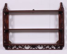 An Edwardian mahogany fret pierced bookcase stand / book shelves.