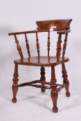 A Victorian 19th century beech and elm smokers bow / windsor armchair.