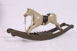 A small painted rocking horse, in the manor of Ayres,
