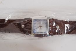An original Fossil watch with brown leather strap having lustre facia complete with box and