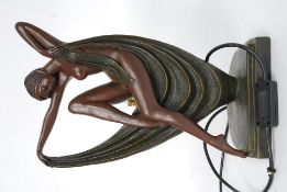 An art deco style lamp off a sitting lady in an undressed manor H38cm