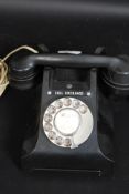 A vintage early 20th century bakelite GPO telephone together with a gentlemans leather attache case