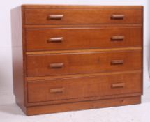 A utility / bombed out Britain straight four chest of drawers in oak raised on a plinth