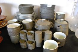 An extensive Denby dinner and tea service in green to include plates, cups,  dinner plates,