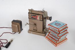 A Pathescope childs projector with original box and instructions along with a small quantity of