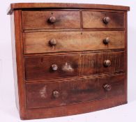 A Victorian bow front mahogany chest of drawers.