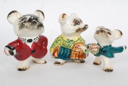 A family of goldscheider figurines, comprising of two adults and child. Each stamped to the base.