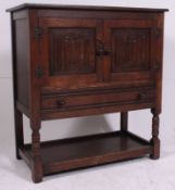 A Jaycee / Old Charm oak side cabinet in the Jacobean revival style.