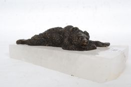 A Russian style bronze model of a bear mounted on a rock crystal base.