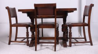 A 1940's post war draw leaf refectory oak dining table raised on block and turned legs complete