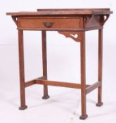 A Victorian Arts & Crafts oak side writing table desk in the manner of Liberty.