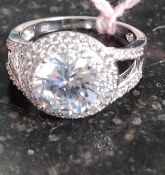 A silver CZ ladies jewellery ring with large central stone (the silver metal stamped 925 indicating