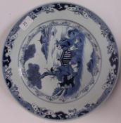 A 19th century Chinese blue and white kang-xi style large plate having central figures under tree