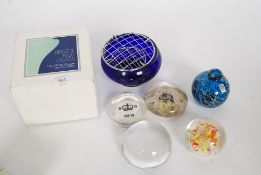 A collection of paper weights to include