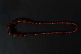 A 20th century resin set tigers eye grad