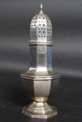 A silver hallmarked sugar sifter by Edwa