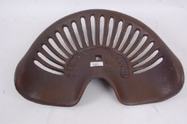 A vintage style metal tractor seat, with