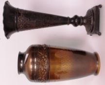 A vintage pressed metal vase having foli