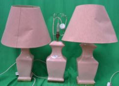 Three retro style lamps set in pink with