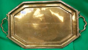 A large brass charger dated 1933 awarded