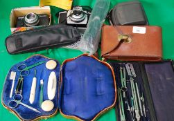 Two vintage cameras along with a draught