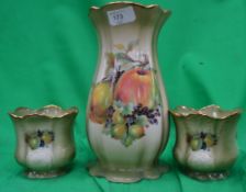 A three piece Staffordshire vase and gar