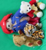 A group of 4 teddy bears to include a Pa